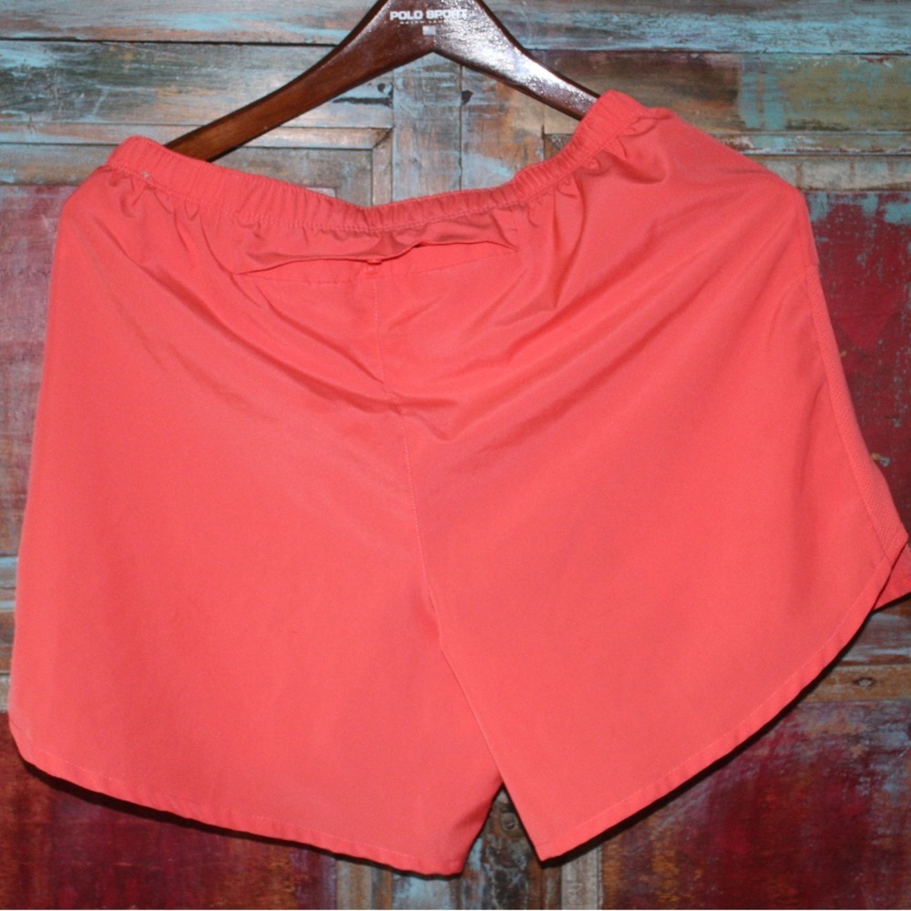 NIKE pink dri- fit running shorts